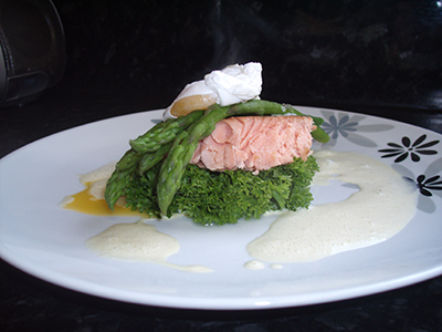 To make the sabayon foam. Place a glass bowl over a pot of barely simmering water and whisk the egg yolks until pale and light, add chopped tarragon and whisky until fluffy, (must be sufficiently thickened so it won't split when cooling), put to one side. Bring a small pot of water to the boil and cook the asparagus for 2 mins (don't overcook) remove and place to one side. Poach the egg until soft in the same water (add a teaspoon of vinegar to the water for poaching to firm up the egg). Slightly warm the salmon (microwave will do for this). Mould the salmon in a pastry cutter. Wilt the spinach in a small pan and bring all the ingredients together -rocket leaves, spinach, salmon, asparagus, poached egg and a drizzle of the foam...and enjoy!
